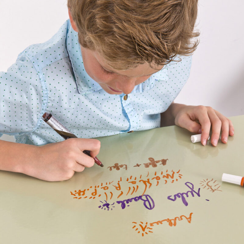 Writable clear dry erase film applied on table for children